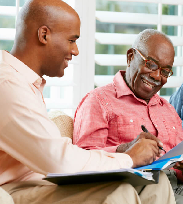 Financial advisor helping a senior couple plan finances for retirement living.